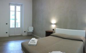 Säng eller sängar i ett rum på Appartamento i Tulipani - 1