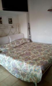 Posteľ alebo postele v izbe v ubytovaní Appartamento Picasso