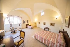 Postel nebo postele na pokoji v ubytování Corte degli Allori - Salento + 28 fotografií