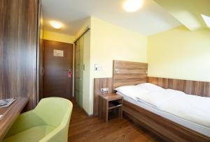 Postel nebo postele na pokoji v ubytování Hotel Meyer