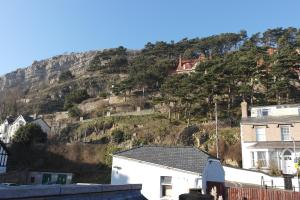 a hill with houses on it with houses on it at Lynton House in Llandudno