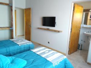 Postel nebo postele na pokoji v ubytování Hostal El Korú