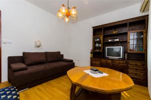 a living room with a couch and a coffee table at House Marija in Trogir