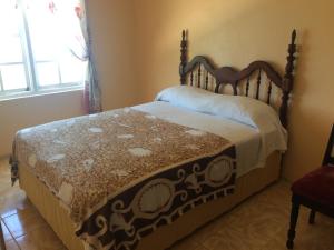 a bedroom with a bed in a room at Ocean Edge Villa in Boscobel