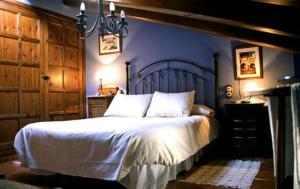 Un pat sau paturi într-o cameră la Casa Gómez