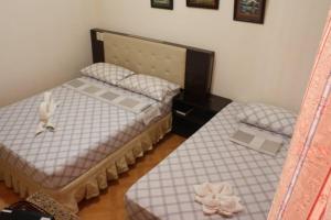 Posteľ alebo postele v izbe v ubytovaní Oslob Malonzo Pension House