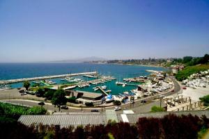 a view of a marina with boats in the water at Hermoso departamento con increíble vista! in Concón