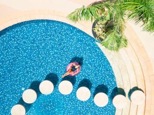 an overhead view of a person in a swimming pool at Savoy Hotel Boracay Newcoast in Boracay