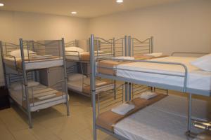 a group of bunk beds in a room at Hotel Desaru Penawar in Desaru