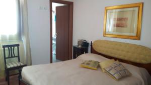 バニョレージョにあるCasa della Pondiのベッドルーム1室(枕2つ付)