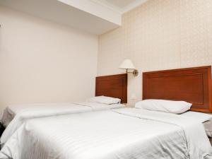Postel nebo postele na pokoji v ubytování Sun Inns Hotel Subang