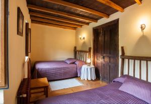 Кровать или кровати в номере Casa de Aldea Vache