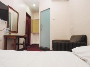 Postel nebo postele na pokoji v ubytování Sun Inns Hotel Subang