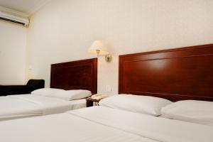 Postel nebo postele na pokoji v ubytování Sun Inns Hotel Subang