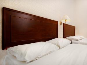 Postel nebo postele na pokoji v ubytování Sun Inns Hotel Subang