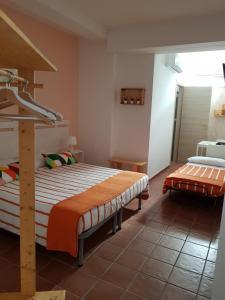 a bedroom with two beds in a room at La Macchia in Melendugno
