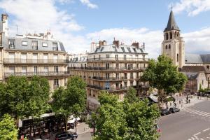 a view of a city with buildings and a street at Au Manoir Saint Germain in Paris