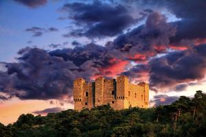 a castle on top of a hill at sunset at Apartment Lara in Senj