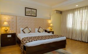 Voodi või voodid majutusasutuse Hotel Vaishali toas