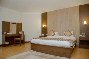 Voodi või voodid majutusasutuse Hotel Vaishali toas