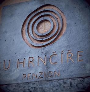 a sign for the entrance to a train station at penzion U Hrnčíře in Hnanice