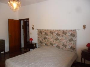 A bed or beds in a room at La zucca violina