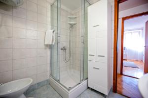 a bathroom with a shower and a sink at Apartment Marconi in Rovinj +30 photos