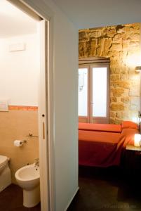 a bedroom with a bed and a window and a sink at Affittacamere B&B Carella in Palermo +70 photos