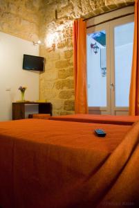 TV a/nebo společenská místnost v ubytování Affittacamere B&B Carella + 37 fotografií