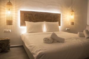Posteľ alebo postele v izbe v ubytovaní Eternal Suites