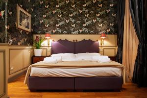 Voodi või voodid majutusasutuse Residenza Borsari toas