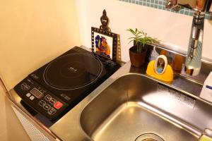 Η κουζίνα ή μικρή κουζίνα στο Kingyosou +21 φωτογραφίες
