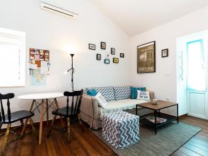 a living room with a couch and a table at Apartment Gaia in Funtana