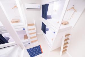 a room with stairs in a tiny house at The Partridge Guesthouse in Cebu City