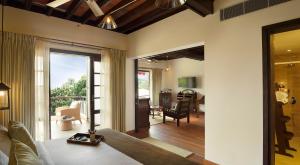 a living room with a view of a living room at The Tamara Kodai in Kodaikānāl