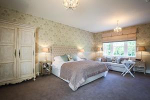 A bed or beds in a room at Hooton Pagnell Hall