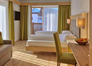 Postel nebo postele na pokoji v ubytování Hotel Rose