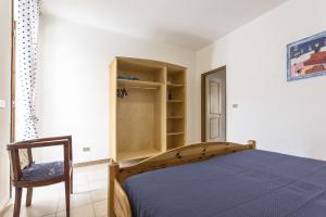 Een bed of bedden in een kamer bij Appartamento Mimosa