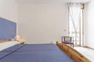 Postel nebo postele na pokoji v ubytování Appartamento Mimosa