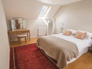 Ένα ή περισσότερα κρεβάτια σε δωμάτιο στο Shakespeare Cottage