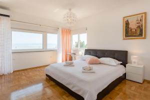 Posteľ alebo postele v izbe v ubytovaní Apartment Sun & Sea