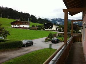 a balcony with two cars parked in a parking lot at Appartement Kurz - Top 3 in Westendorf