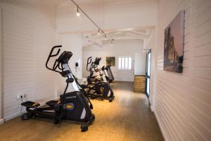 a row of exercise bikes in a fitness room at Tete Ferry Sun in Tete