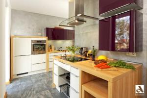 a kitchen with a counter with fruits and vegetables on it at Kapitaensweg 15 in Ostseebad Karlshagen