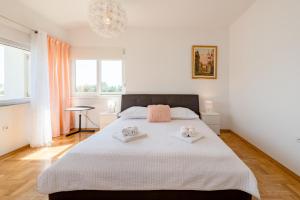 Posteľ alebo postele v izbe v ubytovaní Apartment Sun & Sea