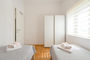 Posteľ alebo postele v izbe v ubytovaní Apartment Sun & Sea