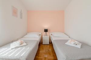 Posteľ alebo postele v izbe v ubytovaní Apartment Sun & Sea