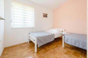 Posteľ alebo postele v izbe v ubytovaní Apartment Sun & Sea