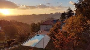 an overhead view of a house with a swimming pool at Casa da Prelada in Amarante