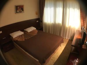 Postel nebo postele na pokoji v ubytování Ataer Hotel